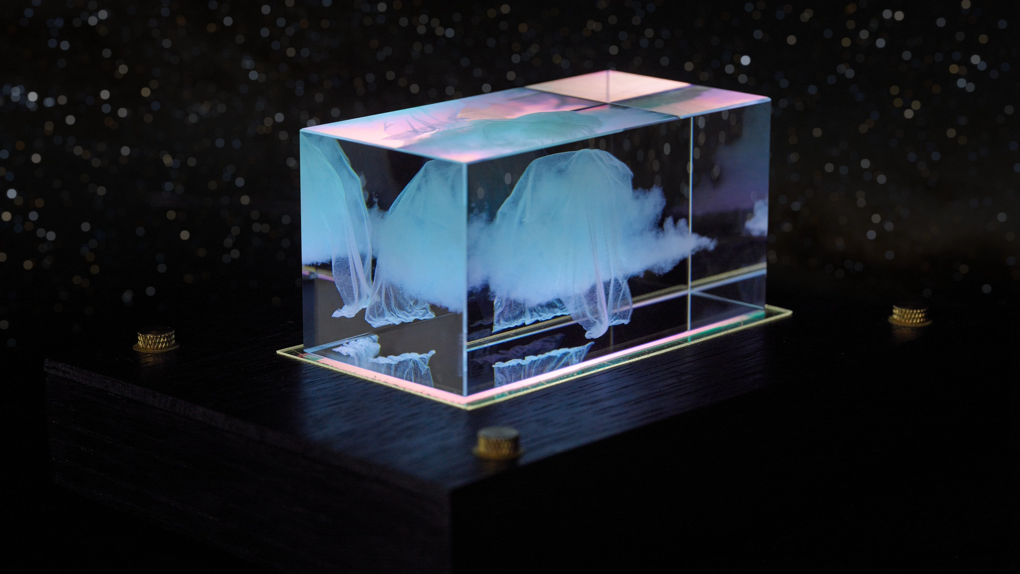 Somnium sculpture against a field of stars
